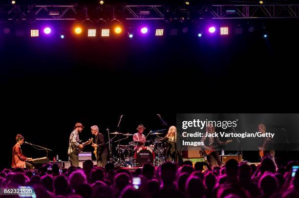 American Rock musician and poet Patti Smith leads her band during a tribute to her late husband, guitarist Fred 'Sonic' Smith, at Central Park...