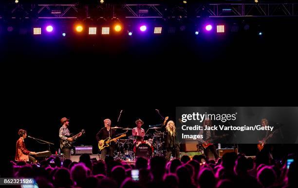 American Rock musician and poet Patti Smith leads her band during a tribute to her late husband, guitarist Fred 'Sonic' Smith, at Central Park...