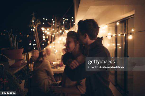 portrait of a couple in love - balcony party stock pictures, royalty-free photos & images