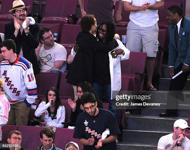 Cari Modine and Whoopi Goldberg attend the Washington Capitals vs. New York Rangers game at Madison Square Garden on April 26, 2009 in New York City.