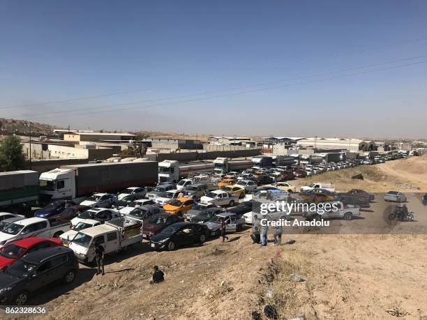 Vehicles are seen on their way back to Kirkuk after Iraqi forces retake the control of the city center from Peshmerga forces in Kirkuk, Iraq on...