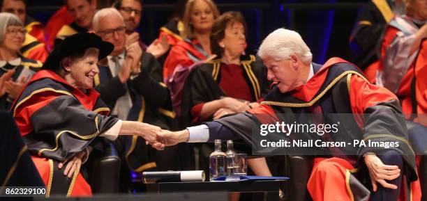 Former US president Bill Clinton shakes hands with Sister Stanislaus Kennedy aftwer they both received an honorary doctorates from Dublin City...
