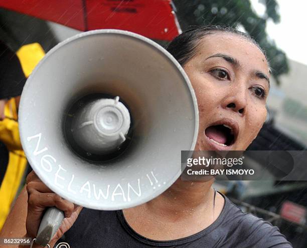 Women demonstators take part in a rally to protest to the United Nations office against the result of the April 9 general election, in Jakarta on...
