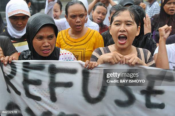 Women demonstators take part in a rally to protest to the United Nations office against the result of the April 9 general election, in Jakarta on...