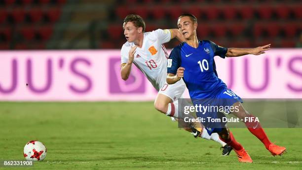 Maxence Caqueret of France and Sergio Gomez of Spain in action during the FIFA U-17 World Cup India 2017 Round of 16 match between France and Spain...