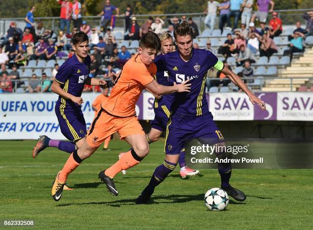 Ben Woodburn of Liverpool competes with Luka Koblar of NK Maribor during the UEFA Youth League group E match between NK Maribor and Liverpool FC on...