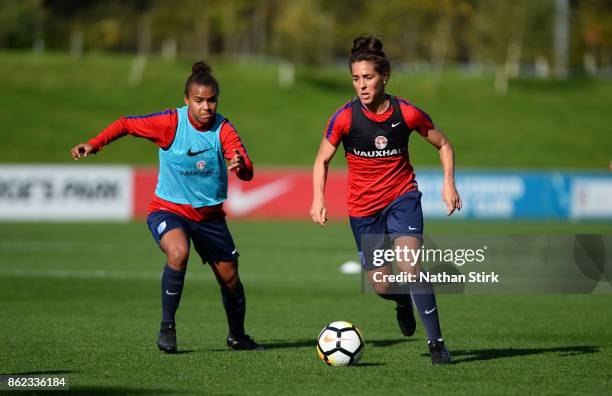 Alex Scott and Fara Williams of England during a training session at St Georges Park on October 17, 2017 in Burton-upon-Trent, England.