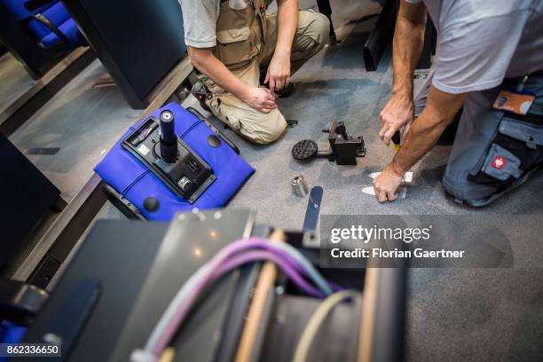 Workers install new seats and working spaces for parliamentarians in the Bundestag at the Reichstag on October 17, 2017 in Berlin, Germany. Following...