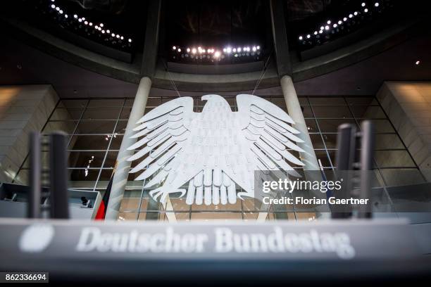 The Federal Eagle is pictured behind the lettering 'Deutscher Bundestag' at the Reichstag on October 17, 2017 in Berlin, Germany. Following German...