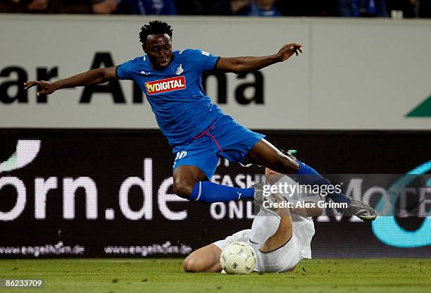 Chinedu Obasi of Hoffenheim is tackled by Leandro Cufre of Berlin during the Bundesliga match between TSG 1899 Hoffenheim and Hertha BSC Berlin at...