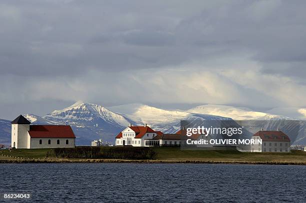 The house of Icelandic President Olafur Ragnar Grimsson is seen outside Reykjavik on April 26, 2009. From left: A chapel, the official meeting...