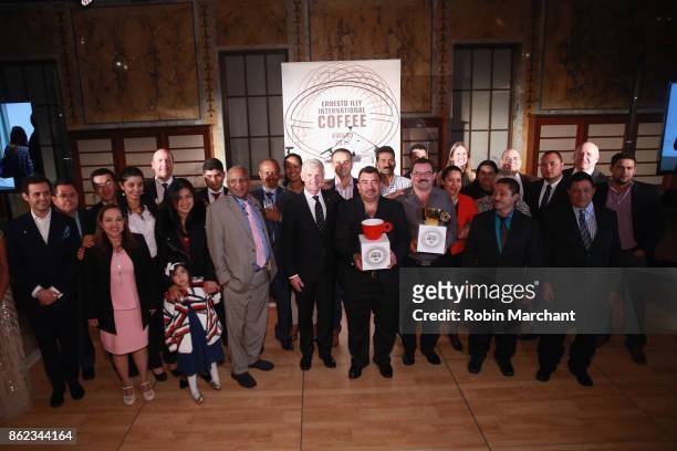 Andrea Illy, Chairman of illycaff poses with guests at the Ernesto Illy International Coffee Award gala at the New York Public Library on Monday,...