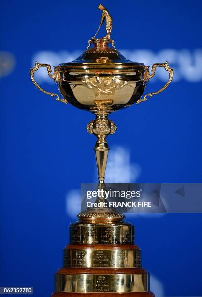 The Ryder Cup's trophy is displayed during a press conference on October 17, 2017 in Paris.