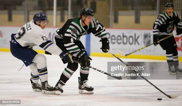 Harrison Roy of the Cedar Rapids RoughRiders skates with the puck against Lucas Breault of the Sioux Falls Stampede during the game on Day 2 of the...