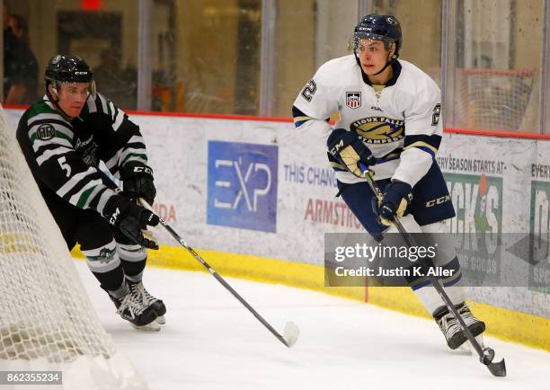 Villella of the Sioux Falls Stampede handles the puck against Chase Blackmun of the Cedar Rapids RoughRiders during the game on Day 2 of the USHL...