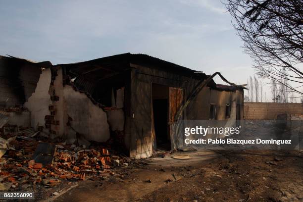 Warehouse is burnt after two people allegedly died trying to defend it from the fire near Penacova on October 17, 2017 in Coimbra region, Portugal....