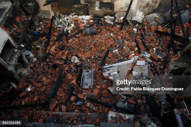 House is destroyed after a gas bottle exploded during a wildfire near Penacova on October 17, 2017 in Coimbra region, Portugal. At least 37 people...