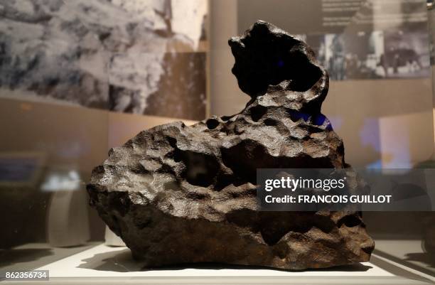 Cape York, a chondrite that fell in Groenland in 1818 is displayed as part of the exhibition "Meteorites, between sky and earth", on October 17, 2017...