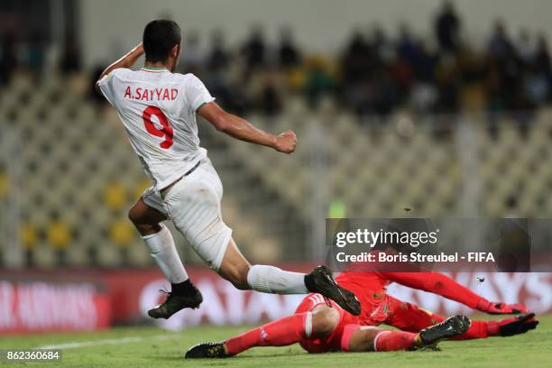 Allahyar Sayyad of Iran is challenged by goalkeeper Cesar Lopez of Mexico during the FIFA U-17 World Cup India 2017 Round of 16 match between Iran...