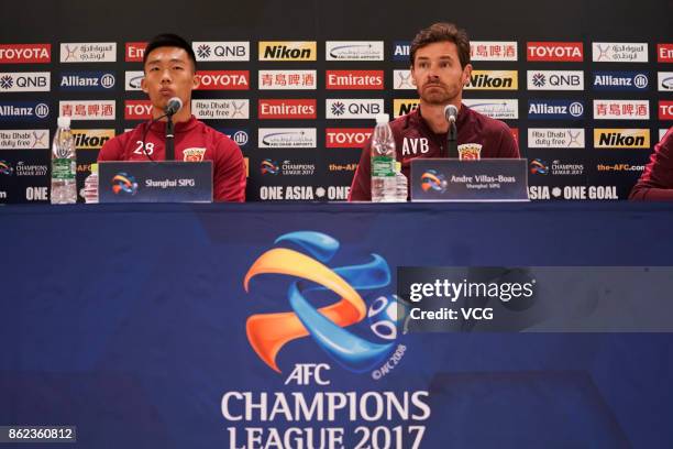 Head coach Andre Villas-Boas and player He Guan of Shanghai SIPG attend a press conference ahead of the AFC Champions League semi final second leg...