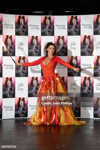 Katie Price poses at a photocall for her new novel 'Playing With Fire' at The Worx Studio's on October 17, 2017 in London, England.