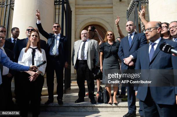 Veteran lawyer and blogger Andrew Borg Cardona accompanied by members of the Parliament and lawyers stand outside the law court in Valletta, Malta,...