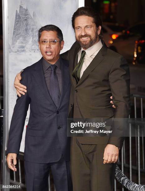 Actor Gerard Butler and Director/Writer/Producer Dean Devlin attend the premiere of Warner Bros. Pictures' 'Geostorm' at the TCL Chinese Theatre on...