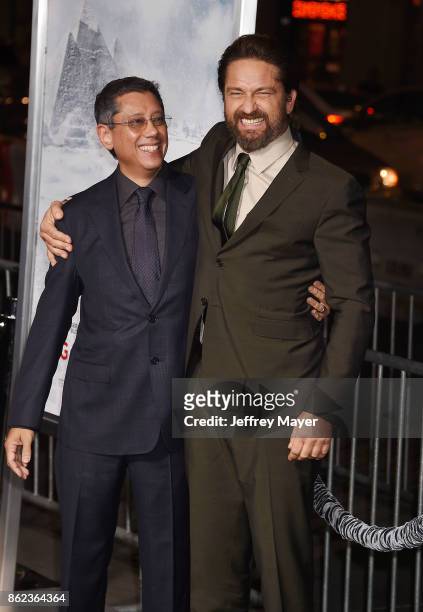 Actor Gerard Butler and Director/Writer/Producer Dean Devlin attend the premiere of Warner Bros. Pictures' 'Geostorm' at the TCL Chinese Theatre on...