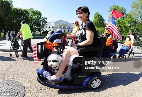 Members of ADAPT, a disability rights group pass the White House ...