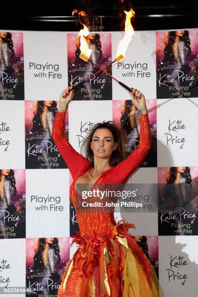 Katie Price poses at a photocall for her new novel 'Playing With Fire' at The Worx Studio's on October 17, 2017 in London, England.