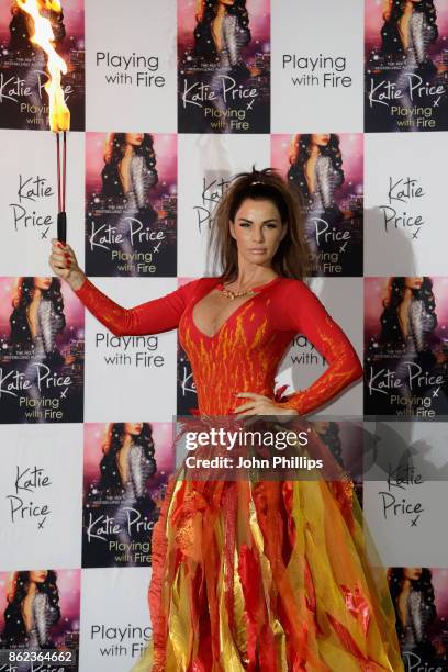 Katie Price poses at a photocall for her new novel 'Playing With Fire' at The Worx Studio's on October 17, 2017 in London, England.