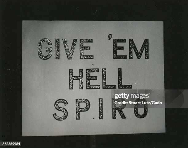 Close-up of a sign from a campus republication group reading "Give 'em Hell, Spiro", promoting politician Spiro Agnew, at North Carolina State...