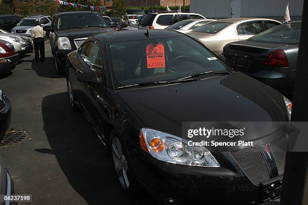 Pontiac cars are displayed at a a General Motors dealership on April 27, 2009 in the Queens borough of New York City. GM has announced that it will...