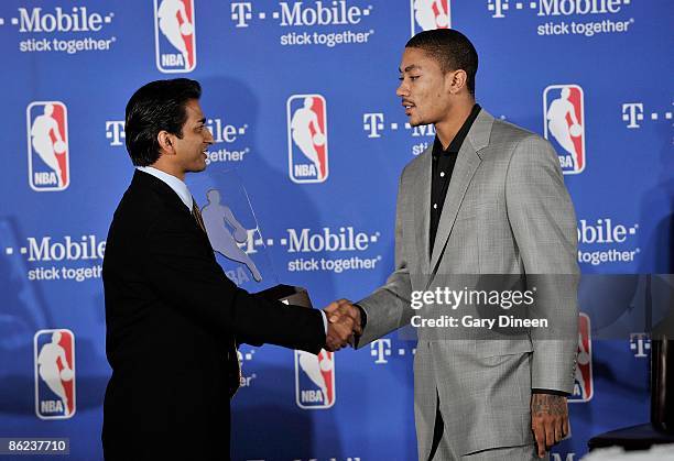 Raj Tank T-Mobile USA Vice President presents Derrick Rose of the Chicago Bulls with the Eddie Gottlieb trophy presented to the T-Mobile NBA Rookie...