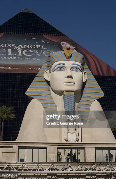 Replica of an Egyptian Sphinx sits at the base of the Luxor pyramid-shaped Hotel as viewed from the Strip street level 2009 Las Vegas, Nevada, early...