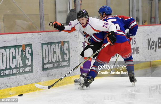 Matthew Barry of the Youngstown Phantoms battles along the boards with William MacKinnon of the Des Moines Buccaneers during the game on Day 4 of the...