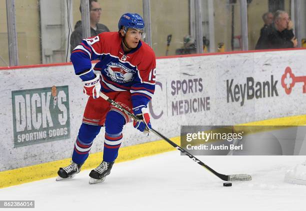 Colin Ugbekile of the Des Moines Buccaneers skates with the puck during the game against the Youngstown Phantoms on Day 4 of the USHL Fall Classic at...