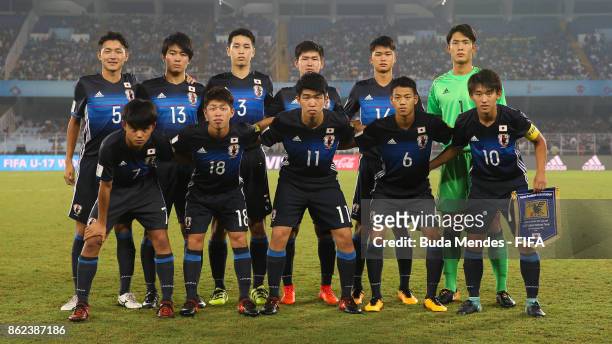 The Japan team line up for a picture during the FIFA U-17 World Cup India 2017 Round of 16 match between England and Japan at Vivekananda Yuba...