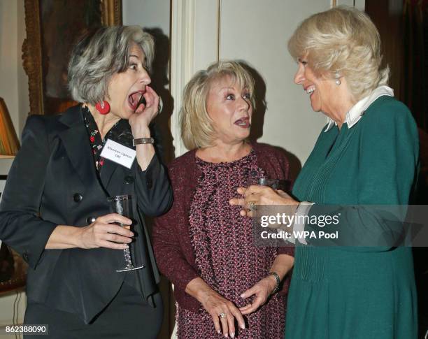 Camilla, Duchess of Cornwall speaks to Maureen Lipman and Elaine Paige attend a reception to celebrate the launch of the 'Our Amazing People'...