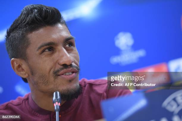 Barcelona's Brazilian midfielder Paulinho holds a press conference in Barcelona on October 17, 2017 on the eve of the UEFA Champions League group D...