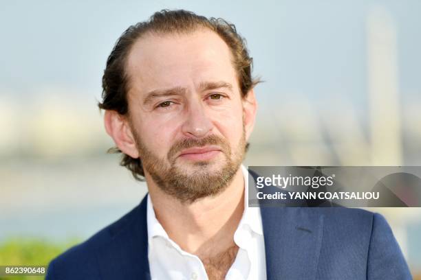 Russian actor Konstantin Khabensky poses during a photocall for the TV drama drama dedicated to Trotsky in the history of Russia, during the MIPCOM...