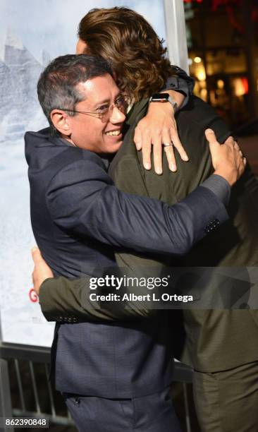 Director Dean Devlin and actor Gerard Butler arrive for the Premiere Of Warner Bros. Pictures' "Geostorm" held at TCL Chinese Theatre on October 16,...