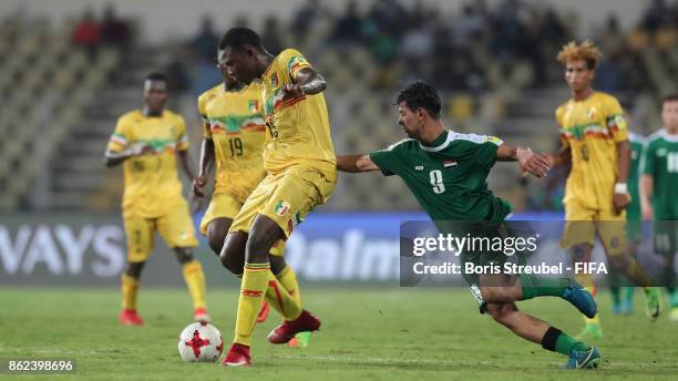 Abdoulaye Diaby of Mali is challenged by Ali Kareem of Iraq during the FIFA U-17 World Cup India 2017 Round of 16 match between Mali and Iraq at...