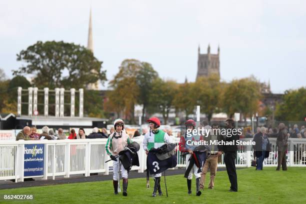 Jockeys Richard Johnson , Ciaran Gethings and Brian Hughes head to the weighing room following the fourth race at Worcester Racecourse on October 17,...