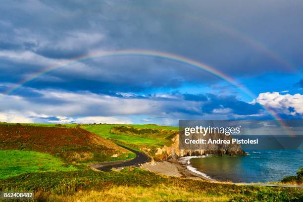 copper coast, ireland - landscap with rainbow fotografías e imágenes de stock