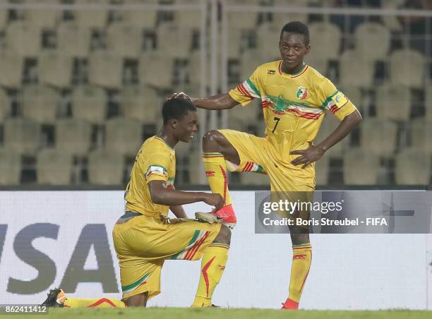 Fode Konate of Mali celebrates with team mate Hadji Drame of Mali after scoring his team's third goal during the FIFA U-17 World Cup India 2017 Round...