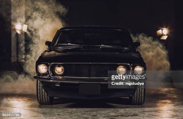 classic black car in garage - front view stock pictures, royalty-free photos & images