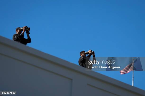 Members of the U.S. Secret Service stand on the roof of the West Wing prior to the arrival of Prime Minister of Greece Alexis Tsipras to the White...