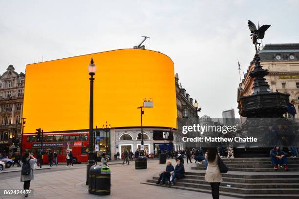 The Piccadilly Circus lights are checked by workmen checking as they are prepared to be switched back on, on October 17, 2017 in London, England....