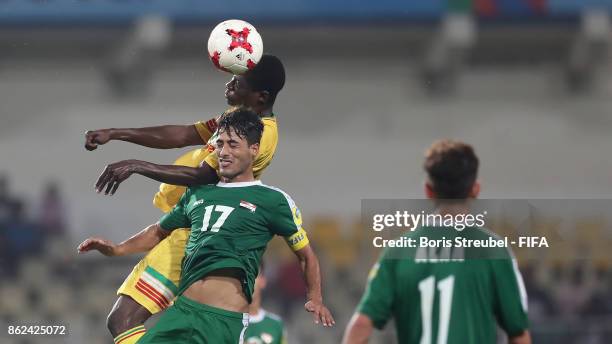 Mohammed Ali of Iraq jumps for a header with Siaka Sidibe of Mali during the FIFA U-17 World Cup India 2017 Round of 16 match between Mali and Iraq...